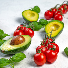 Ingredients: avocado, tomato and basil. copy space
