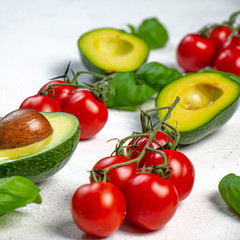 Ingredients: avocado, tomato and basil. copy space