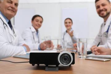 Fototapeta premium Video projector on table during medical conference