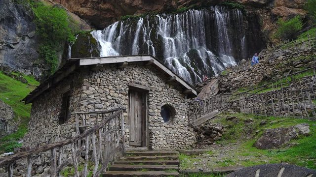 Aladaglar National Park waterfalls, waterfall in Aladaglar National Park in Turkey, Kapuzbasi waterfall Kayseri Turkey, water mill on the waterfalls, Old weathered wooden water mill building, Old fash