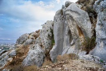 huge statue of charon engraved on a rock at st. pierre church location, antakya, turkey