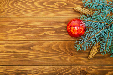 Beautiful Christmas border of spruce and toys on a wooden vintage background