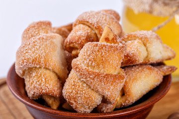 pile of fresh and delicious kroissants and rolls on a white background