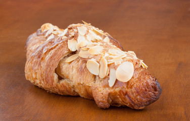 Fresh delicious Almond crescent on wood table