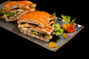 Fresh sandwich with grilled chicken, cheese and vegetables