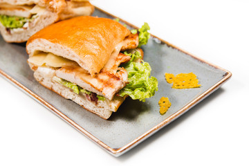 Fresh sandwich with grilled chicken, cheese and vegetables