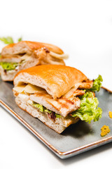 Fresh sandwich with grilled chicken, cheese and vegetables