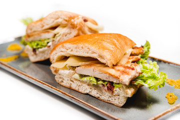 Fresh sandwich with grilled chicken, cheese and vegetables