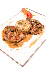 Meal with stuffed chicken and risotto with a sauce