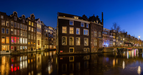 Obraz premium Red light district medival building at night. Amsterdam, Netherlands