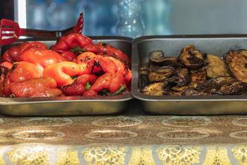 Culinary buffet with takeaway healthy food - meat, pepper, spices, grilled vegetables. Fish and...
