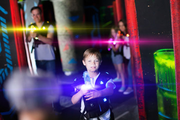 Obraz na płótnie Canvas Boy in beams during laser tag game
