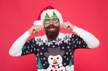 Be fashionable and celebrate. Happy hipster in fashionable santa style. Bearded man twirl fashionable mustache. Holiday celebration. Christmas and new year. Fashionable design for festive holidays