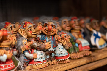 Vintage scandinavian doll toys on a wooden shelf