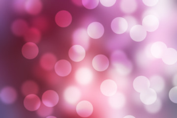 Purple light effect. Glowing particles on a colored background. Beautiful pink bokeh background.