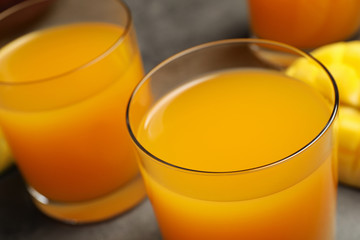 Fresh delicious mango drink on table, closeup