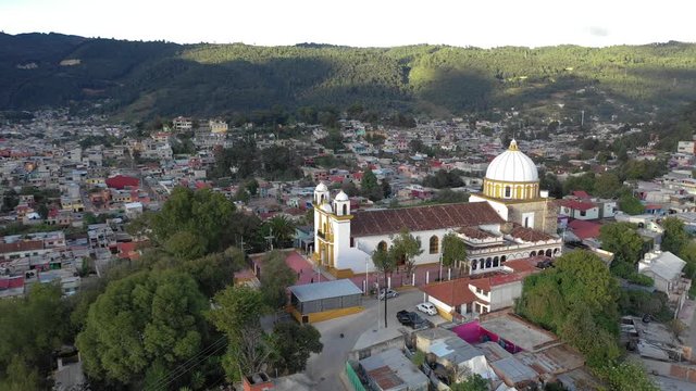 Aerial view of San Cristobal de las Casas in Chiapas, Mexico. Drone orbiting around the church in Mexico.