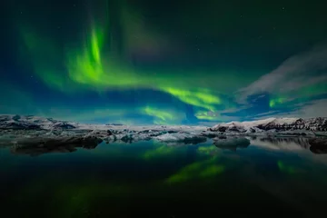 Poster Aurora Borealis over a glacier lagoon in Iceland © Daniel