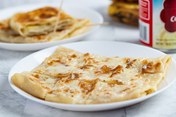 Layered Banana flatbread served with condensed milk
