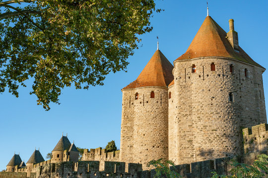 Medieval fortress Cite de Carcassonne in the morning rays of the sun. Carcassonne, France. 26 nov 2019