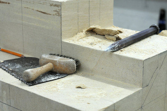 Sandstone Block With Tools Of A Stonemason