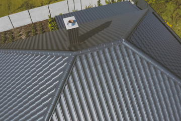 Fototapeta premium Corrugated metal roof and metal roofing. Modern roof made of met