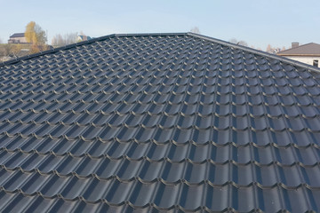 Naklejka premium Corrugated metal roof and metal roofing. Modern roof made of met