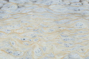 Foam made by sea waves as abstract background