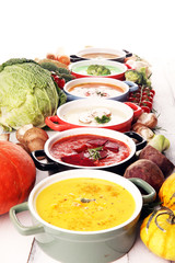 Variety of colorful vegetables cream soups and ingredients for soup. Concept of healthy eating or vegetarian food with mushrooms