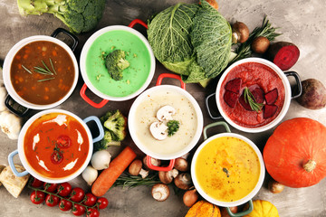 Variety of colorful vegetables cream soups and ingredients for soup. Concept of healthy eating or vegetarian food with mushrooms