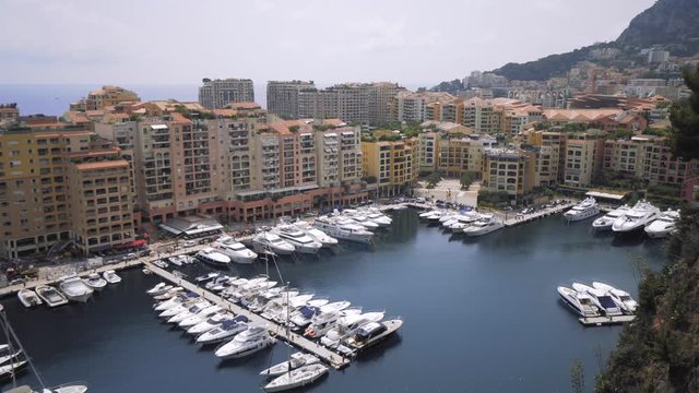 Luxury Yachts in Monaco Port, sunny Monte Carlo City, 4K shot