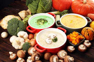 Variety of colorful vegetables cream soups and ingredients for soup. Concept of healthy eating or vegetarian food with mushrooms