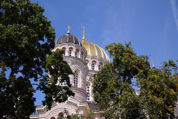 Fototapeta na wymiar Golden domes of Nativity Church in Riga