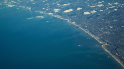 The view from the airline window on the ocean coast. 