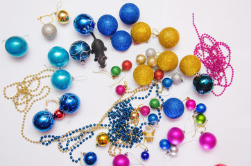 colorful christmas decorations scattered on a white background, preparation for decorating the Christmas tree