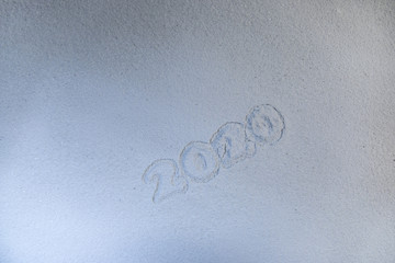 Artwork decoration. Happy new 2020 year. Empty space for your text. 2020 written on the snow
