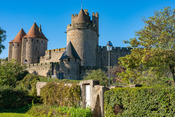 Medieval fortress Cite de Carcassonne in the morning rays of the sun. Carcassonne, France. 26 nov 2019