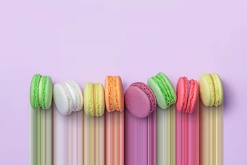 Fototapete Rund Top view of colorful macaron biscuits in a row on pastel color block background, flat lay, pixel stretch © mikelaptev
