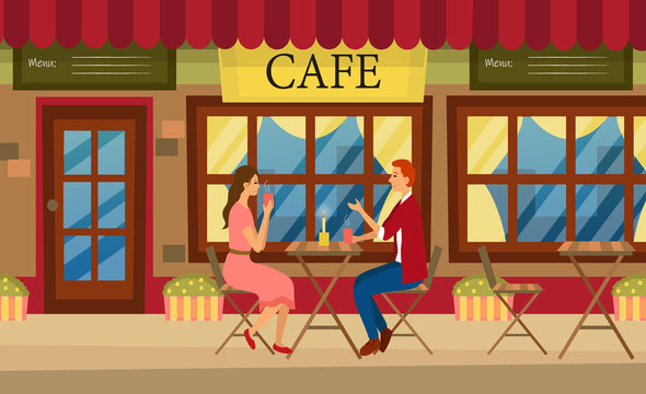 Loving couple is drinking coffee in a cafe. A man and a woman are sitting at the table in a cozy restaurant.