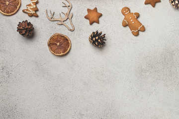 Eco christmas concept, clementines in cotton mesh bag, wooden ornaments, pinecones, gingerbread