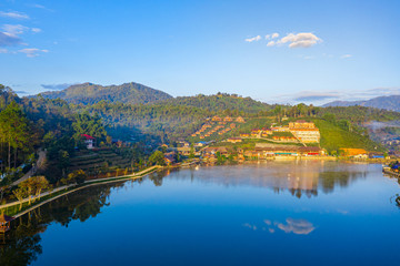 Fototapeta premium Aerial landscape of Ban Rak Thai with sunrise in the morning located in Maehongsan province, Thailand.