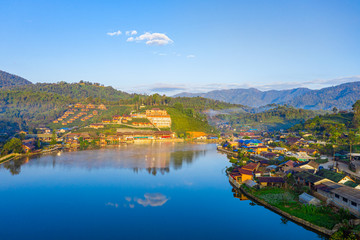 Fototapeta premium Aerial landscape of Ban Rak Thai with sunrise in the morning located in Maehongsan province, Thailand.
