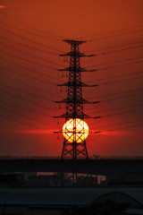 Naklejka premium China, city sundown and power lines. 