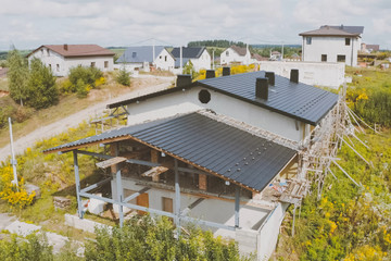 dark gray roof of an industrial building made of metal. Corrugat