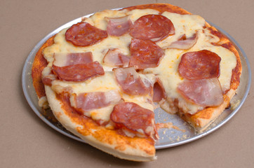  cheese pizza, ham, pepperoni and olives