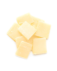 Pieces of tasty Parmesan cheese on white background
