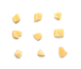 Pieces of tasty Parmesan cheese on white background