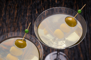 Two cocktails with martini and green olives,top view.