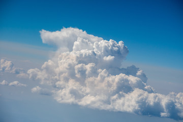 Fluffy white clouds in a beautiful blue sky