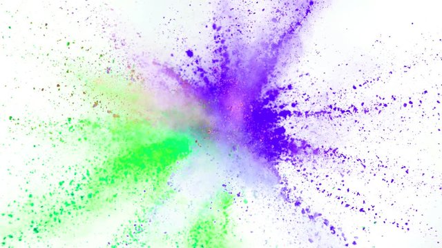Colorful powder exploding on white background in super slow motion, close-up.